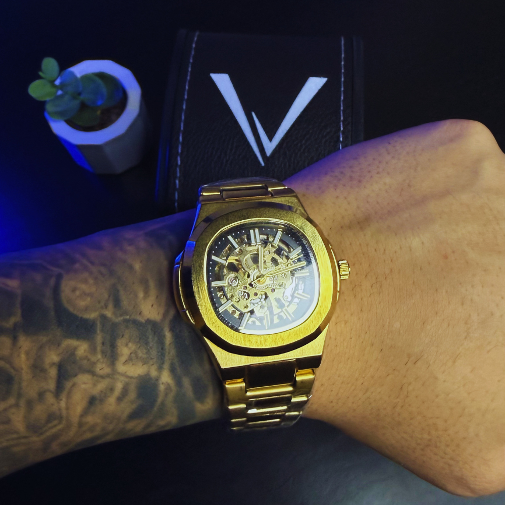 Relógio automático Veleno Aurum Gold com mostrador dourado e pulseira de couro, estilo elegante e sofisticado.